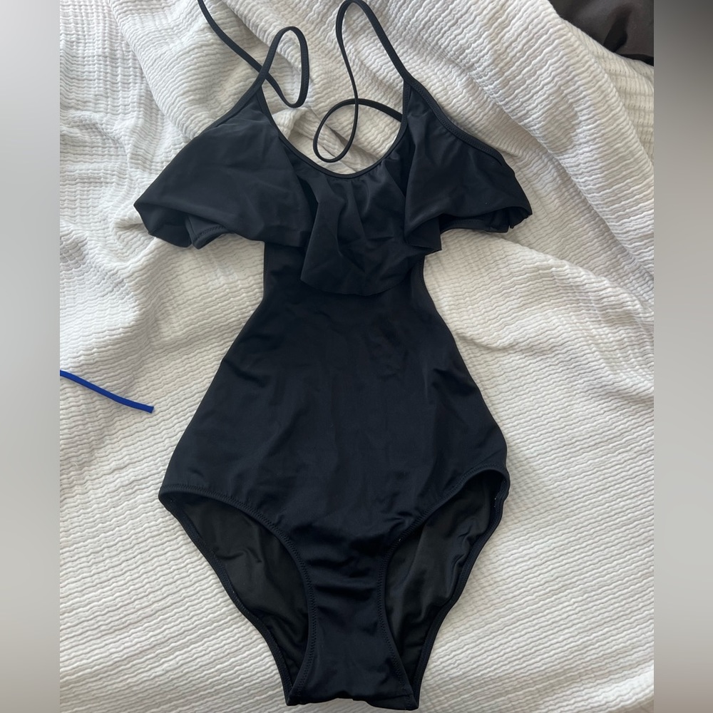 Victoria’s secret black cutout one piece with an adorable ruffle at the neckline